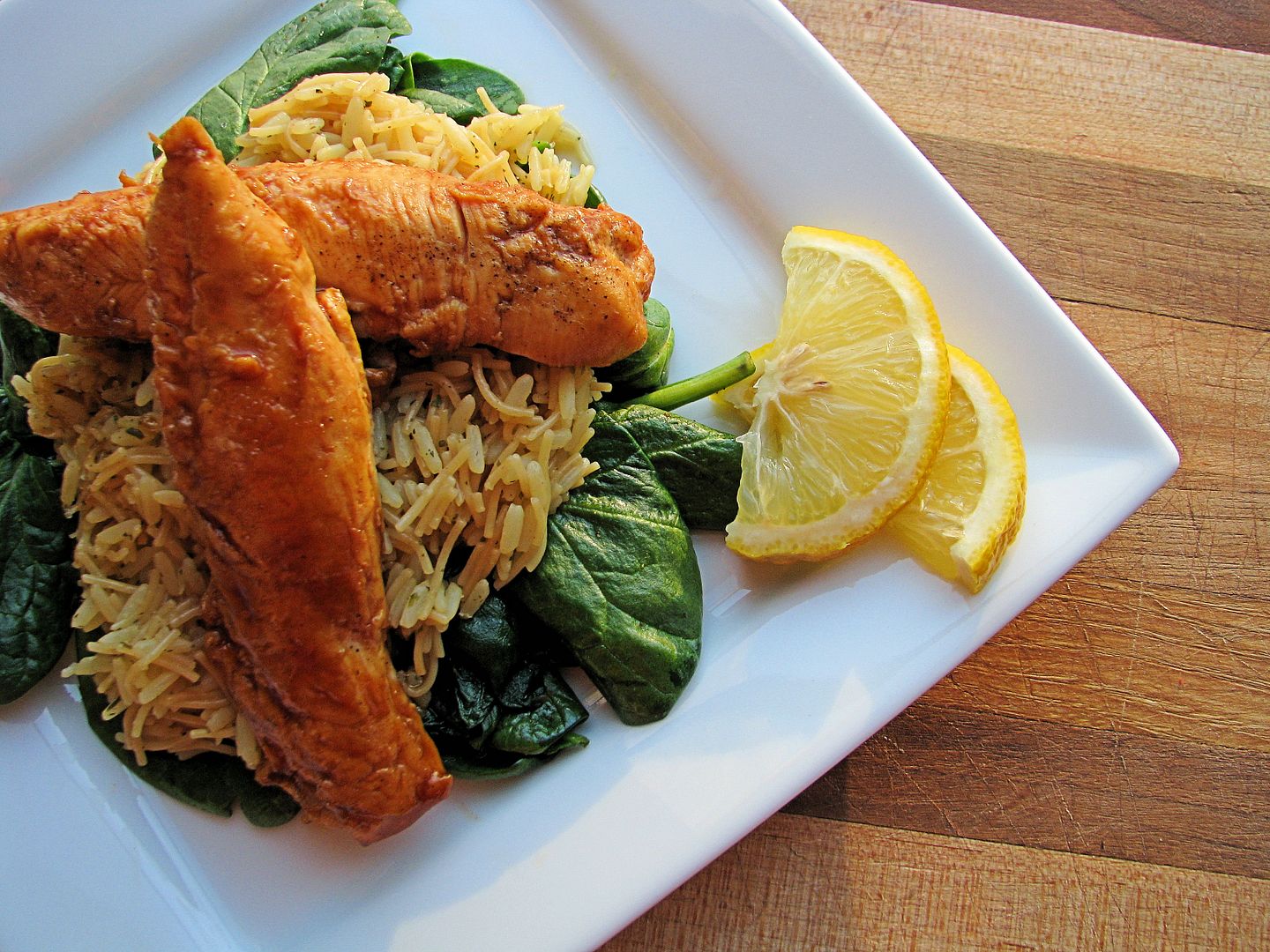 BBQ Chicken Tenders and Rice over Steamed Spinach